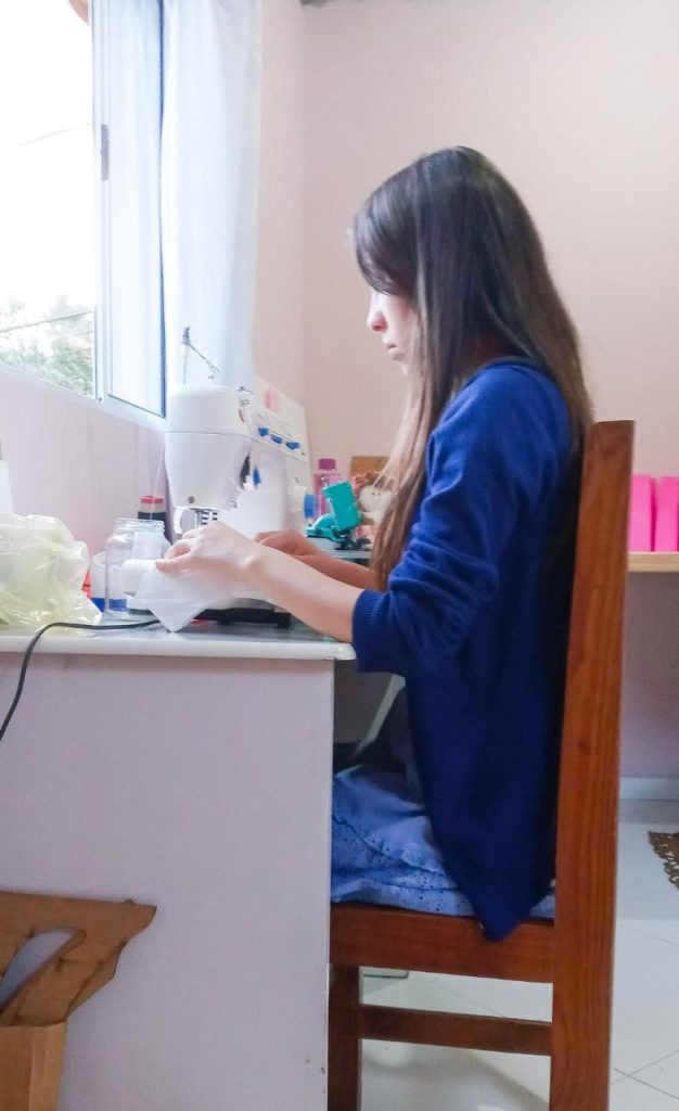 Seamstress at work sits in chair